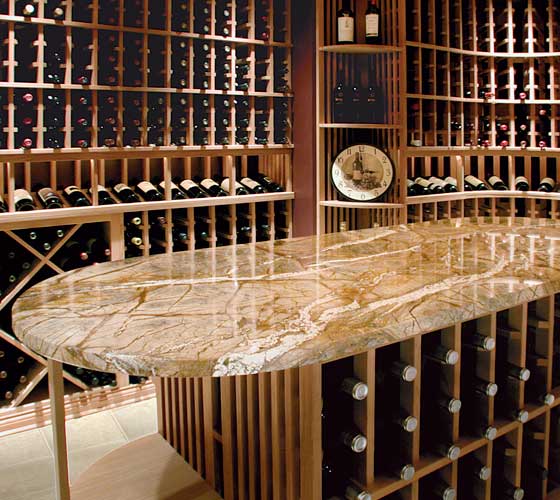 wine cellar with granite oval island with wine storage below