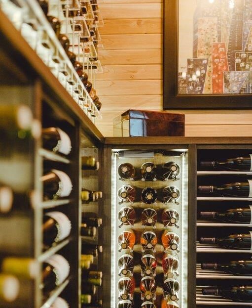 wine cellar with fridge and acrylic shelves